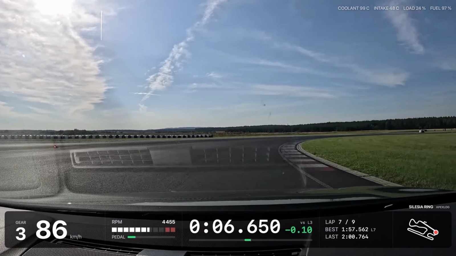 Frame from the overlay video: gear 3 and 86 km/h, an RPM bar at 4455 with the pedal bar under it, running lap time 0:06.650 with −0.10 against lap 3, lap 7 of 9 with best 1:57.562 and last 2:00.764, a Silesia Ring mini-map, and coolant 99 °C, intake 48 °C, load 24 % and fuel 97 % along the top